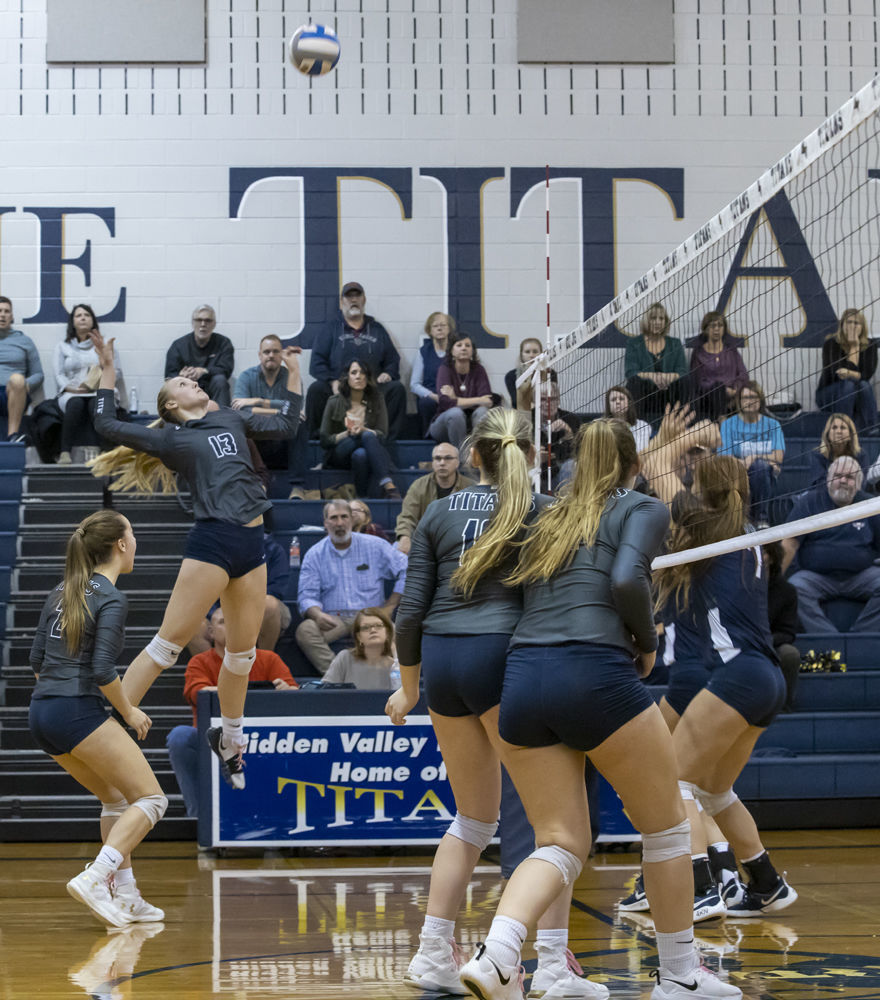 Hidden Valley's (13) Cam Davenport goes up for the spike as teammates (2) Claire Nichols, (10) Faith Mitchell and (4) Abigail Atkins look on.